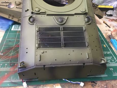 I cut out the deck with a razor saw to merge with the Tamiya upper hull with the track guards in place.