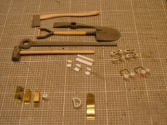 Armed with several reference books (one really good one on modeling the 75mm Sherman by Osprey [Steve Zaloga]) I spent the last few evenings working away at all of the scratch built tool holders and fasteners.