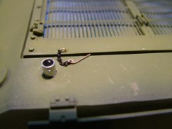 This time I followed Ethan's lead and added a more accurate tool bracket for the ideler adjustment wrench on the back ledge of the rear deck. Tamiya simply molds a raised cylindrical post or boss on the rear hull plate. This can easily be improved.