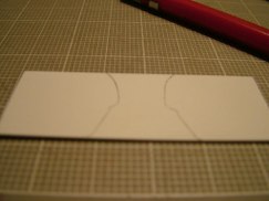 I stood the resin part on end and traced the silouette of each end onto some .040 styrene. Then using three pieces of 1/2" x 1/2" pine cut to length, I glued them in an "L" shape.
I decided to make the airbox out of solid wood covered in a styrene skin. I chose the wood as I wanted to make it stout. I plan on screwing it directly to the rear plate at final assembly.
