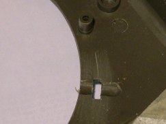 Moving to the underside of the hull I used a Dremel motor tool to grind a cylindrical channel perpendicular to each rectangular through hole.