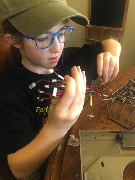 Intern works on the wire bundle.