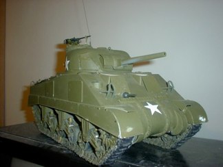 Somewhat inspired by Tiff Williams and the extreme challenge of this project, I took out my old 21st Century toys Sherman and began scavenging components.  A surprise twist has arrived!  I acquired a cast hull sample from Nick Aquilar and decided to reshape it onto the early variant!